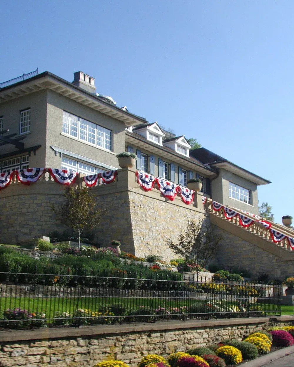 A custom-built two-story home with a walkout basement set into a sloped lot in the Hart Farms area of south Rochester.