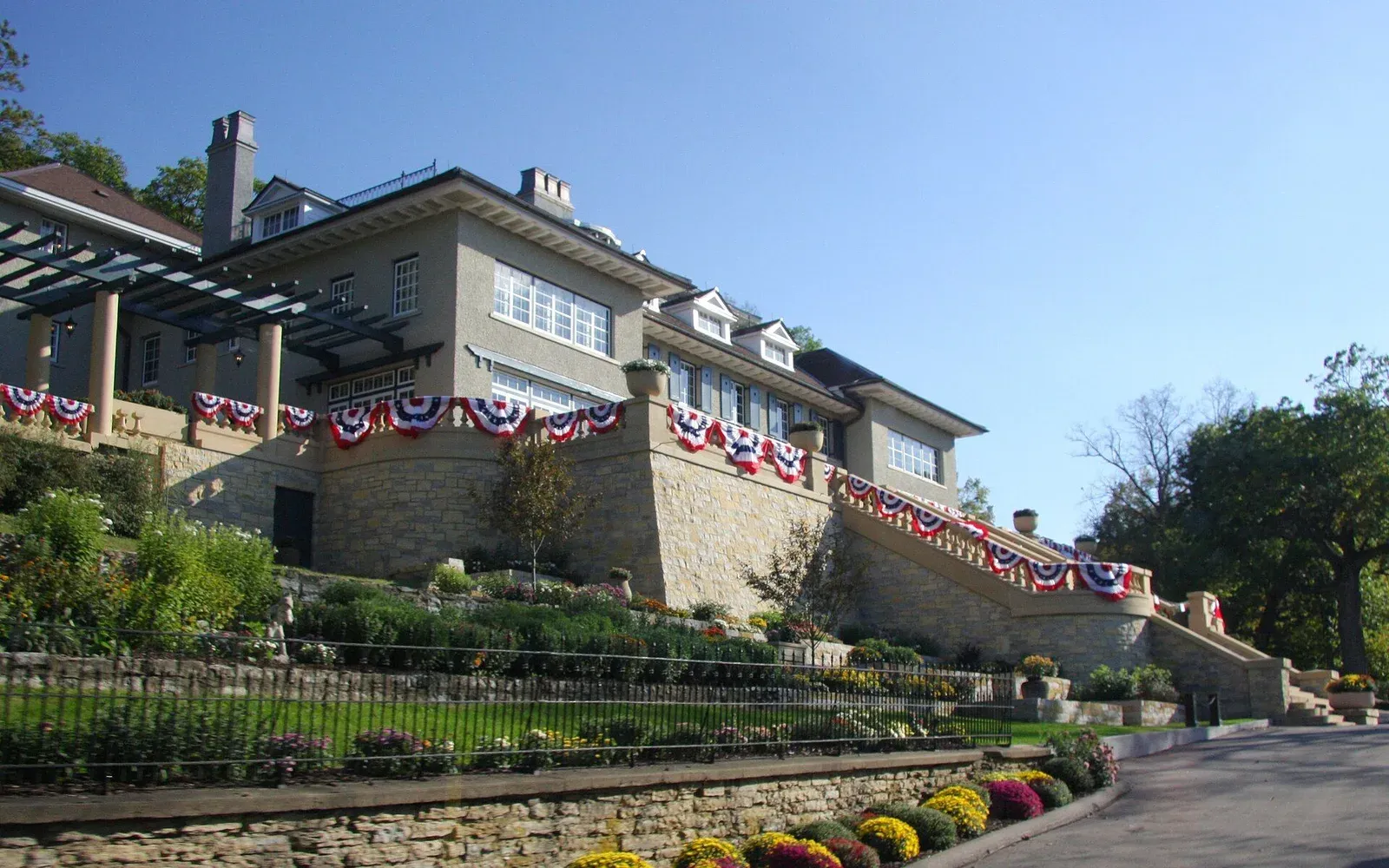 A custom-built two-story home with a walkout basement set into a sloped lot in the Hart Farms area of south Rochester.