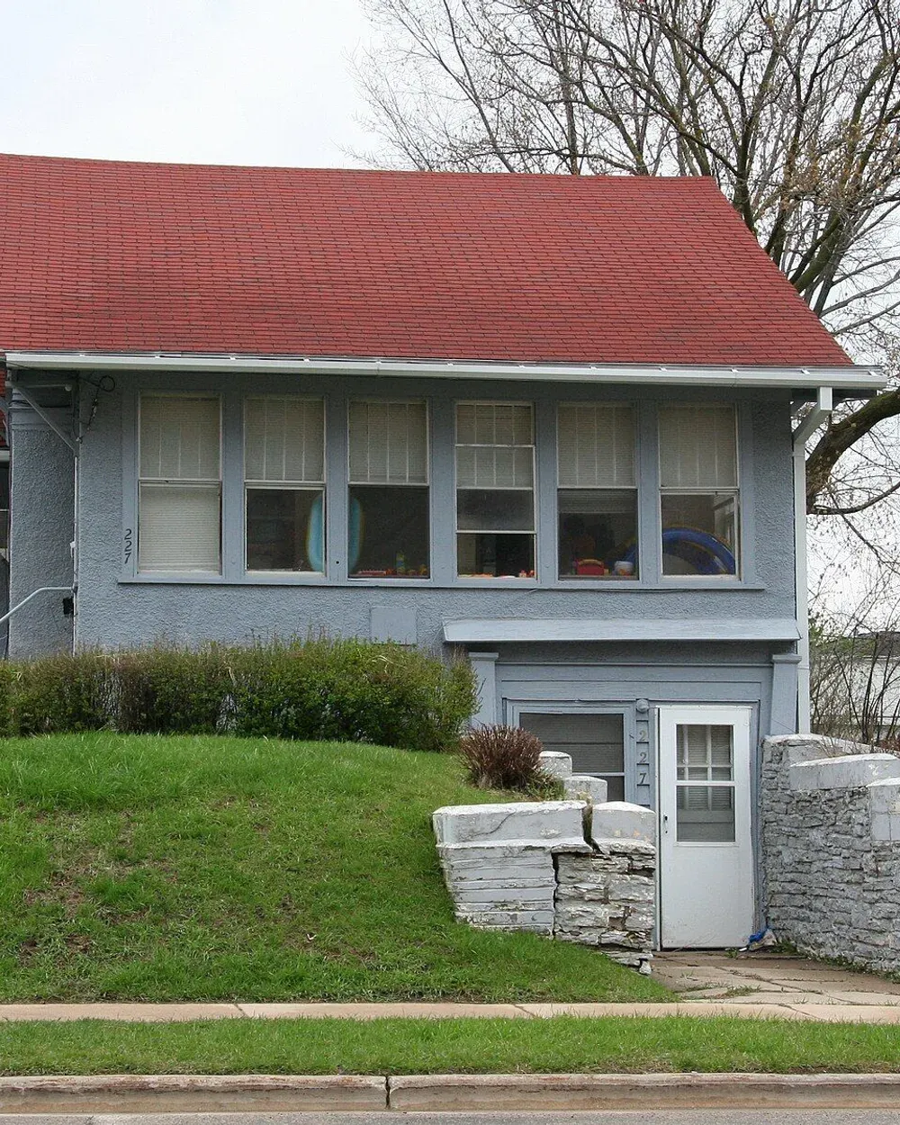 A modern home with a covered front porch on a residential street in Manor Woods, northwest Rochester, Minnesota.