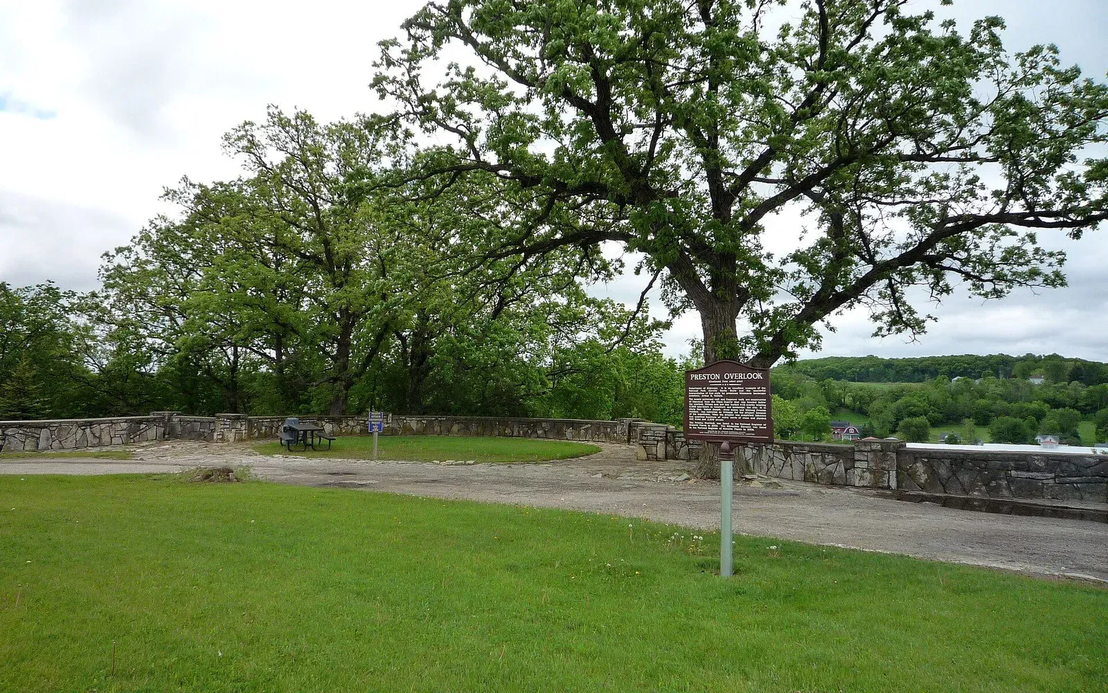 The Preston Overlook, a stone-walled scenic overlook above the Root River valley, with bluff country visible in the distance near Preston, Minnesota.